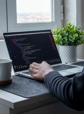 Developer writing code for web design and development services